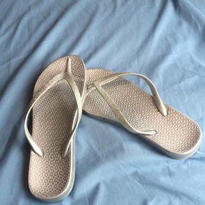 Silver sparkly rubber flip flops
